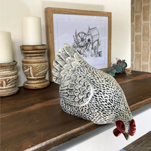 Load image into Gallery viewer, speckled white chook sitting down and looking over the edge