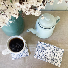 Load image into Gallery viewer, set of 4 coasters with trailing blue green leaves