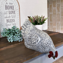 Load image into Gallery viewer, a white chook leaning forward looking over the edge at something