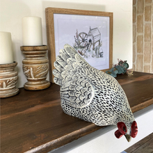 Load image into Gallery viewer, speckled white chook sitting down and looking over the edge
