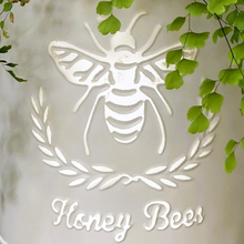 Load image into Gallery viewer, round metal planter with the word honey bees and a single embossed bee
